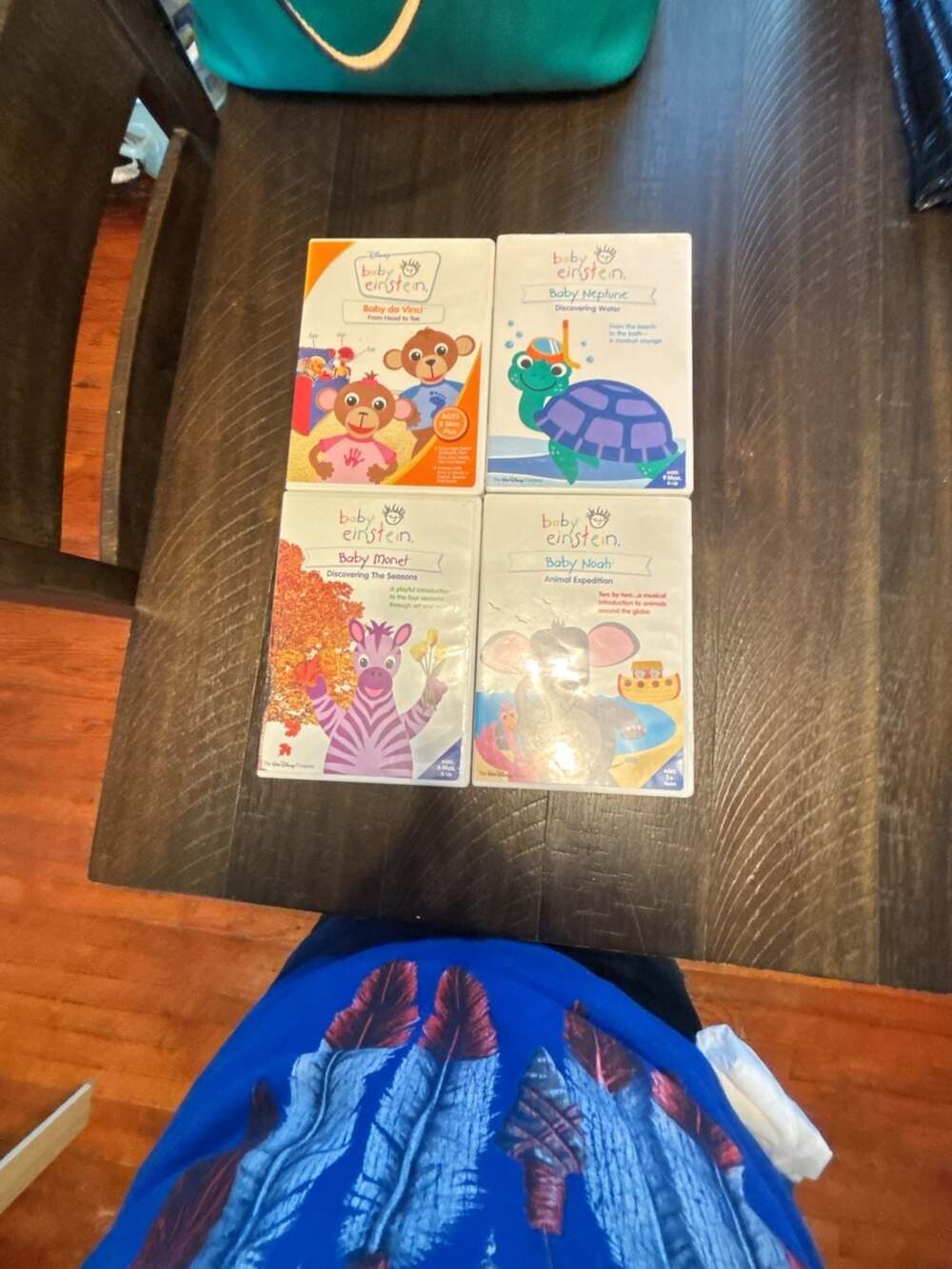 Set of 4 Baby Einstein DVDs: Baby da Vinci, Baby Neptune, Baby Monet, and Baby N
